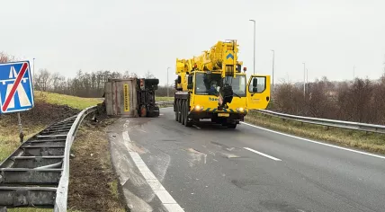A truck carrying clay is overturned on the A8 motorway, January 28, 2025.