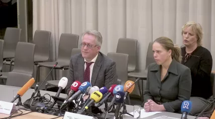 Rotterdam Chief Prosecutor Hugo Hillenaar and Mayor Carola Schouten at a press conference announcing the arrest of a man suspected of executing three men at random in the city’s IJsselmonde District. 3 January 2025