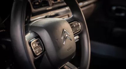 Citroen logo on a steering wheel of a Citroen car C3