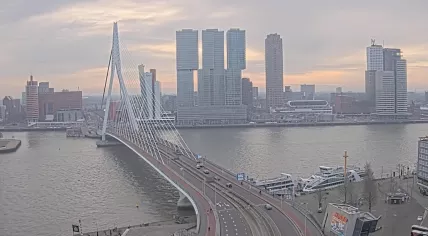 The sun peeking through the clouds at the Erasmus Bridge in Rotterdam, 31 January 2025