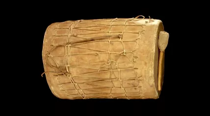 A Tigua double-headed drum and drumstick made from cottonwood and hide by the Ysleta del Sur Pueblo Native American tribe in the 19th century