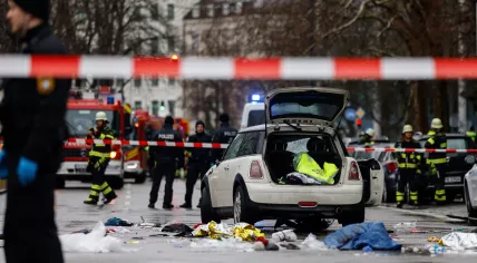 Members of the emergency services work at the scene where a car drove into a crowd in the southern German city of Munich on February 13, 2025 leaving several people injured, police said.