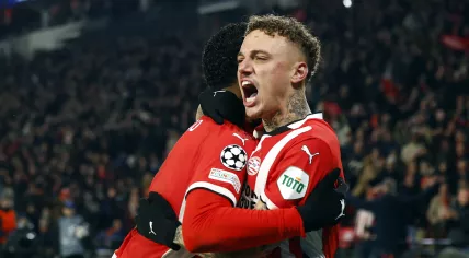 Ryan Flamingo of PSV Eindhoven, Noa Lang of PSV Eindhoven celebrate the 3-1 during the UEFA Champions league Play-off match between PSV Eindhoven and Juventus FC at Phillips Stadium on February 19, 2025 in Eindhoven, Netherlands.