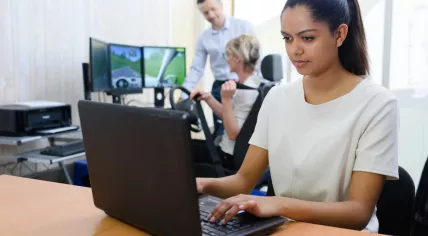 Learner driver using laptop to train for theory test