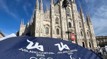 Milan, italy - September 14, 2024: official logo Olympic games in Milan and Cortina 2026 on background of Cathedral Duomo