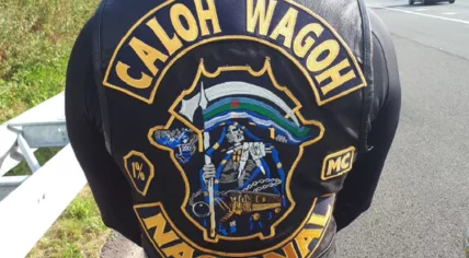 The back of a vest featuring the Caloh Wagoh motorcycle gang logo