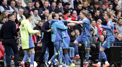 Bertrand Traore of Ajax, Kenneth Taylor of Ajax, Jordan Henderson of Ajax celebrate the 0-2 during the Dutch Eredivisie match between PSV Eindhoven and AFC Ajax at Phillips Stadium on March 30, 2025 in Eindhoven, Netherlands.