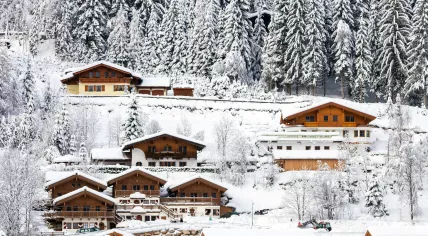 Snow covered hotels near a ski piste in Flachau, Austria
