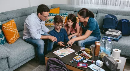 A family is preparing emergency kits