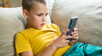 Young boy using a smartphone
