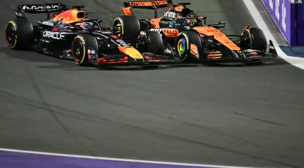 Red Bull Racing's Dutch driver Max Verstappen and McLaren's Australian driver Oscar Piastri race during the 2025 Saudi Arabia Formula One Grand Prix at the Jeddah Corniche Circuit on April 20, 2025.