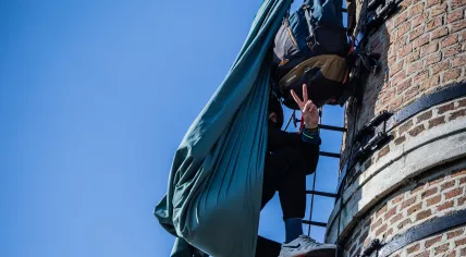 Pro-Palestine activist that climbed on to one of the chimneys of a former boiler house on the grounds of Radboud University Medical Center Nijmegen.