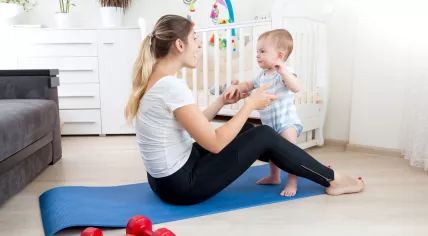Mother of a toddler tries to workout.