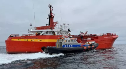 A KNRM rescue ship alongside the Glomar Venture after the supply ship collided with a windmill on the North Sea, off the coast of Callantsoog. 20 April 2025