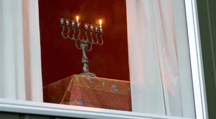 Hanukkah menorah on the first day of Hanukkah - symbols of the Jewish faith