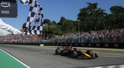 Red Bull Racing's Dutch driver Max Verstappen crosses the finish line in first place during the 2025 Emilia Romagna Formula One Grand Prix at the Imola autodrome in Imola, on May 18, 2025.