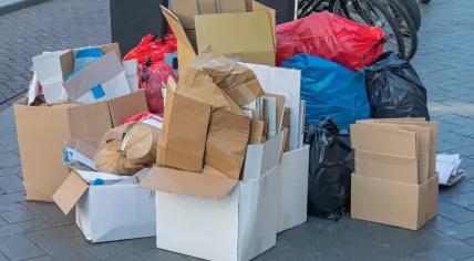 Cardboard boxes and garbage bags on the street