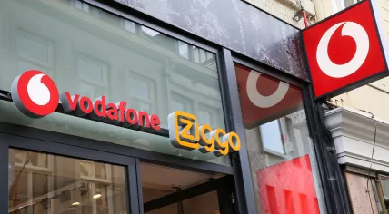 View of a  store entrance with logo lettering of Vodafone and Ziggo, Maastricht, February 13, 2022.