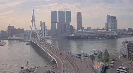 A warm Friday morning in Rotterdam with the Mein Schiff 3 ship docked at the Cruise Terminal near the Erasmus Bridge. 2 May 2025