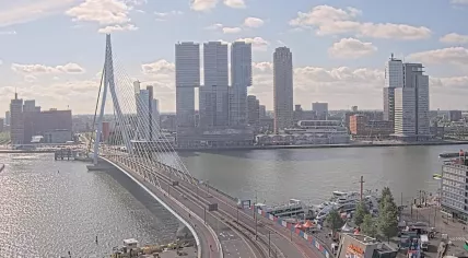 Fluffy clouds above the Erasmus Bridge on a chilly spring day in Rotterdam, 6 May 2025