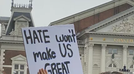 Demonstrators carry banners at ‘No Tyrants’ rally in Amsterdam against Trump’s ‘authoritarian overreach’.