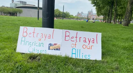Banners at ‘No Tyrants’ rally in Amsterdam against Trump’s ‘authoritarian overreach’.