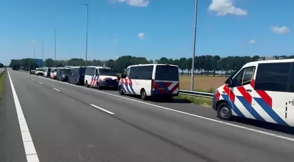 Dutch police vans ready to escort world leaders between Schiphol Airport and the NATO summit in The Hague, 24 June 2025