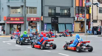 Tokyo, Japan - March 7, 2018 : Street kart tour, Mario kart tour is tourists dress up in superhero character costume and driving go-kart through the main travel attractions in the city of Tokyo