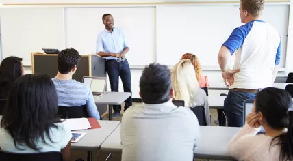 Teacher and students during a university lecture.