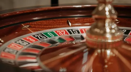 A European Roulette wheel with only a single "0" flanked by a black "26" and a red "32", and without a double-zero pocket