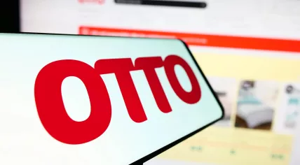 Otto logo displayed on a screen in front of the company’s open website
