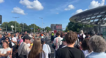 Passengers queue to get on the metro at Noorderpark station during Sail, August 20, 2025.