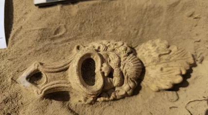 Decorated Roman oil lamp discovered by archeologists in Cuijk, Noord-Brabant. 