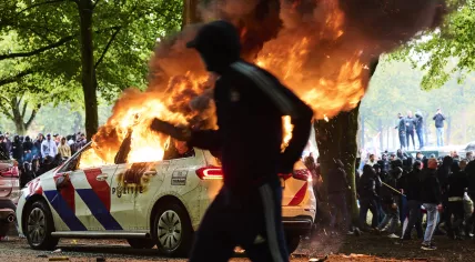 Rioters set a police car on fire during an anti-immigration protest on and around the Malieveld in The Hague, 20 September 2025
