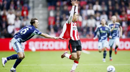 Youri Regeer of Ajax and Sergiño Dest of PSV Eindhoven during the Dutch Eredivisie match between PSV Eindhoven and Ajax at the Philips Stadion on September 21, 2025, in Eindhoven, Netherlands.