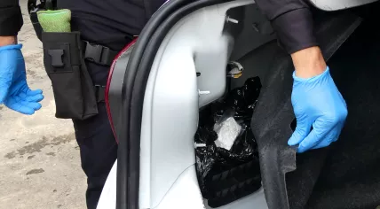 Police discover a small cache of cocaine hidden in a car