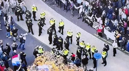 Riot police keep anti-asylum and anti-fascism protesters apart in Amersfoort, 30 September 2025