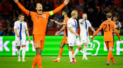 Cody Gakpo of the Netherlands celebrates scoring a goal at the Johan Cruijff ArenA during the Dutch national team's 2026 FIFA World Cup qualifying match against Finland.