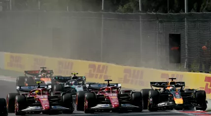 Ferrari's British driver Lewis Hamilton, Ferrari's Monegasque driver Charles Leclerc, and Red Bull Racing's Dutch driver Max Verstappen race during the Mexico City Formula One Grand Prix at the Hermanos Rodriguez racetrack in Mexico City on October 26, 2025.