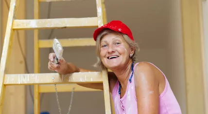 A woman is renovating.