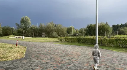 A young boy looks out on the horizon as Storm Amy approaches Amsterdam. 4 October 2025