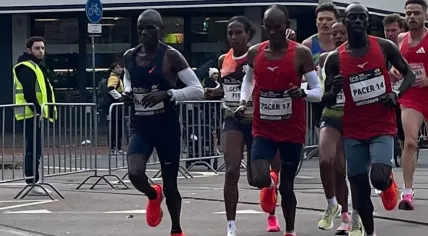 Aynalem Desta of Ethiopia, winner of the women’s race, runs alongside other competitors during the Amsterdam Marathon, Oct. 19, 2025.