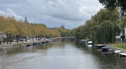 Looking west along Mauritskade in Amsterdam towards the Olifantsbrug with dark clouds forming overhead. 22 October 2025