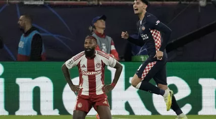 PSV's Ricardo Pepi, right, celebrates after scoring his side's opening goal during a Champions League opening phase soccer match between Olympiacos and PSV in Piraeus port, near Athens, Greece, Tuesday, Nov. 4, 2025.