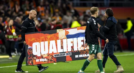 A sign is brought onto the pitch to mark the Netherlands’ qualification after the World Cup qualifier between the Netherlands and Lithuania on November 17, 2025, in the Johan Cruijff ArenA in Amsterdam, the Netherlands.
