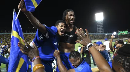 Curaçao players and fans celebrate World Cup 2026 qualification after a 0-0 draw with Jamaica at the National Stadium in Kingston, Jamaica on 18 November 2025.