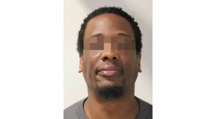 Booking photo of Claimond M., 42, from Rotterdam, was wanted by police in the murder of Sherwin Peterhof, 41, from Suriname, whose body was found in a cornfield near the Belgian-Dutch border on August 15, 2025.