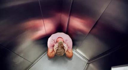 A man is distressed after being trapped in an elevator.