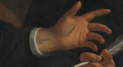 A tattoo of a comet seen on the wrist of a subject in a portrait of the Chief Commissioners of the Amsterdam Harbor Works, 1674, by Wallerant Vaillant.