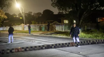 Police establish a crime scene at a suspect’s home in Bonnyrigg following a deadly shooting at Bondi Beach, Sydney, Australia, 14 Dec. 2025.